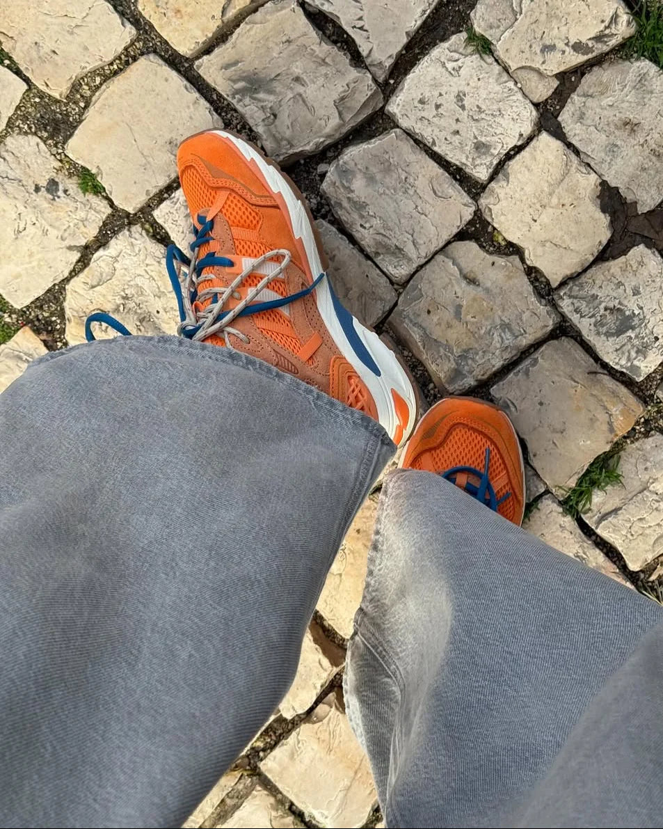 Coolway 2003 in Orange is a vintage-inspired runner that blends sporty heritage with modern street style