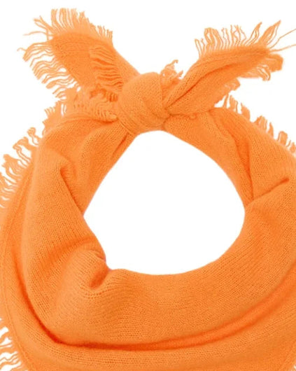 A bright orange knit bandana or scarf with fringed edges, tied in a knot at the top, shown on a plain white background.