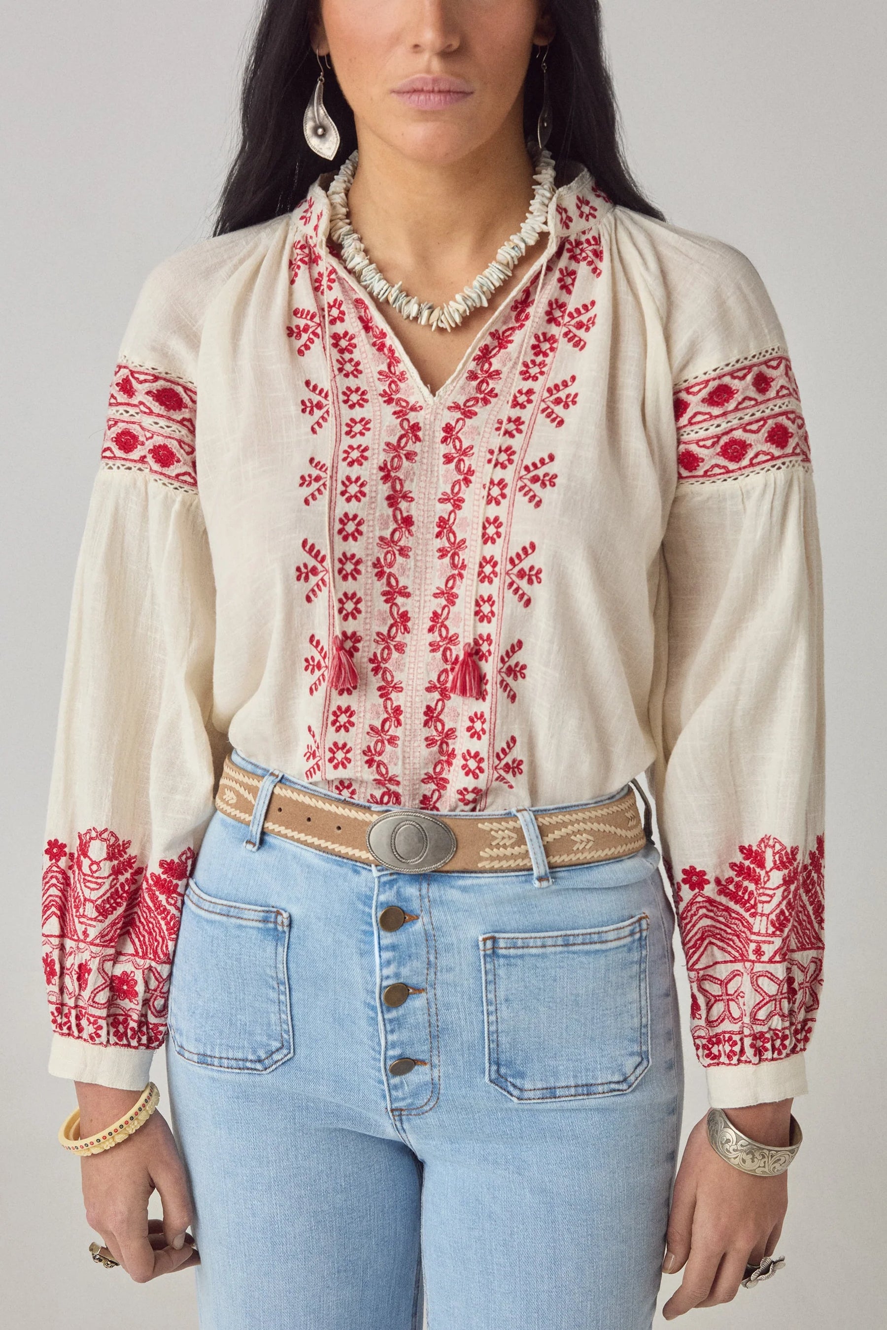 Maison Hotel Antonella Blouse Red Poppy in Cranberry is a beautifully embroidered cotton blouse inspired by traditional Ukrainian styles.