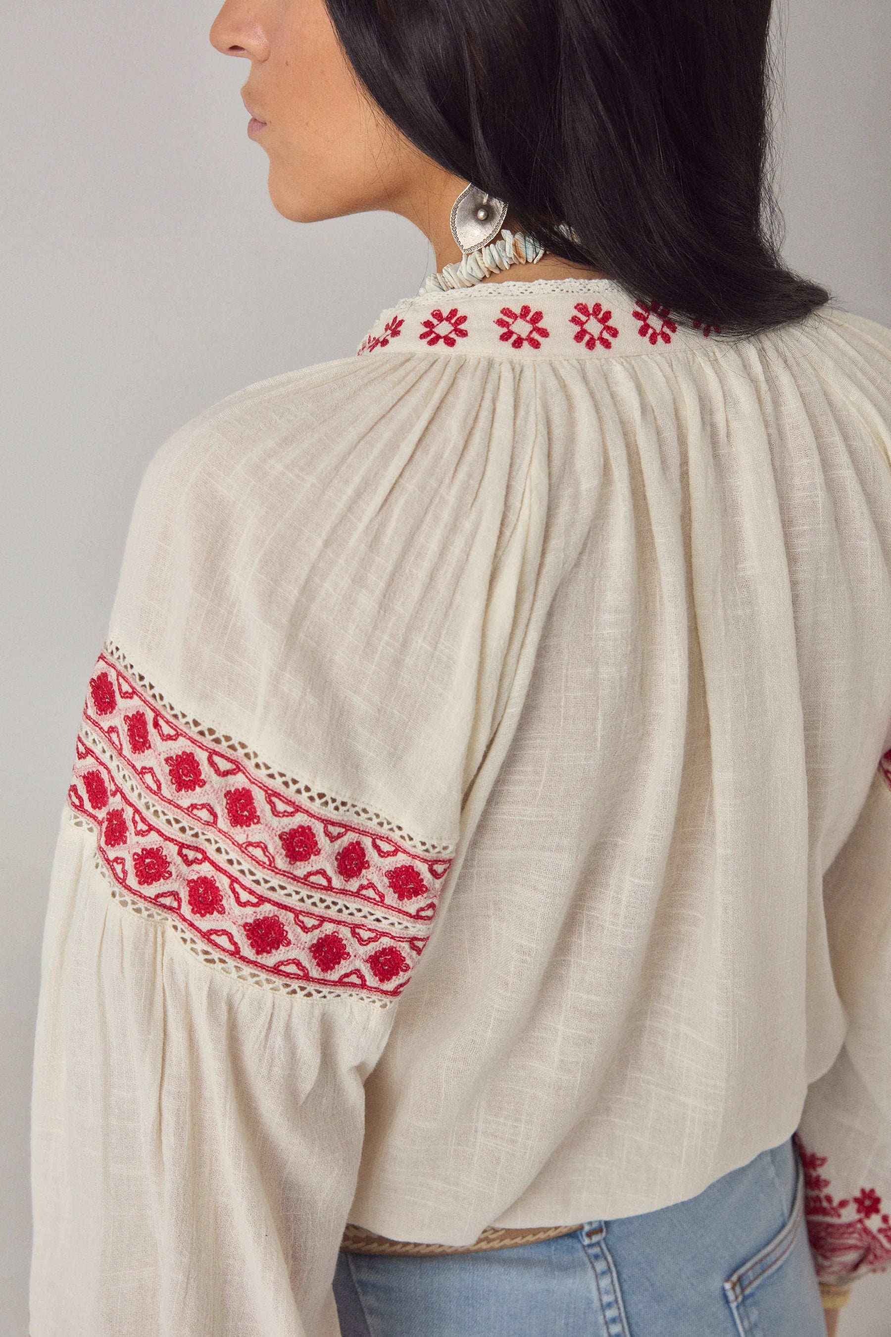 Maison Hotel Antonella Blouse Red Poppy in Cranberry is a beautifully embroidered cotton blouse inspired by traditional Ukrainian styles.