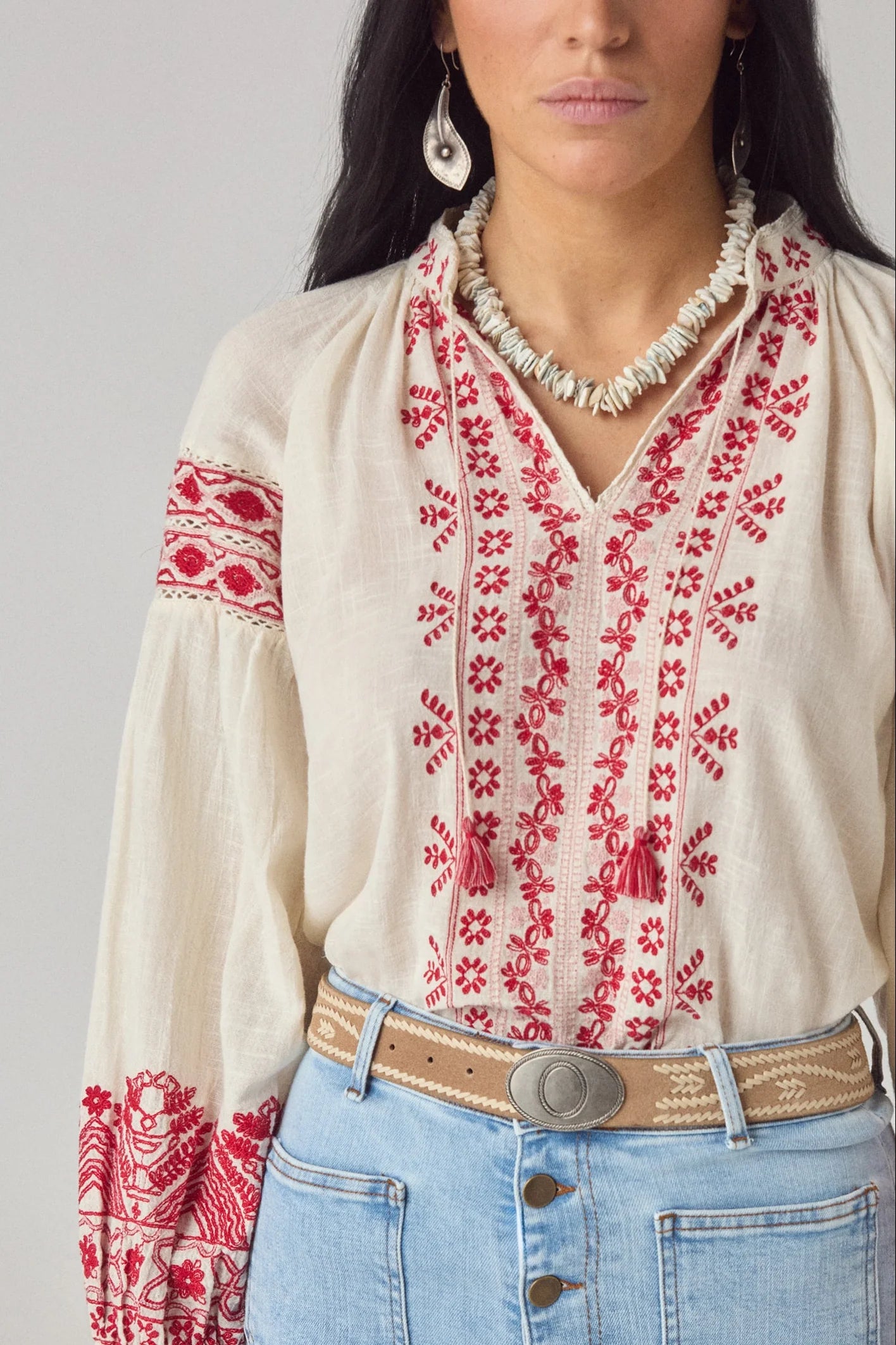 Maison Hotel Antonella Blouse Red Poppy in Cranberry is a beautifully embroidered cotton blouse inspired by traditional Ukrainian styles.