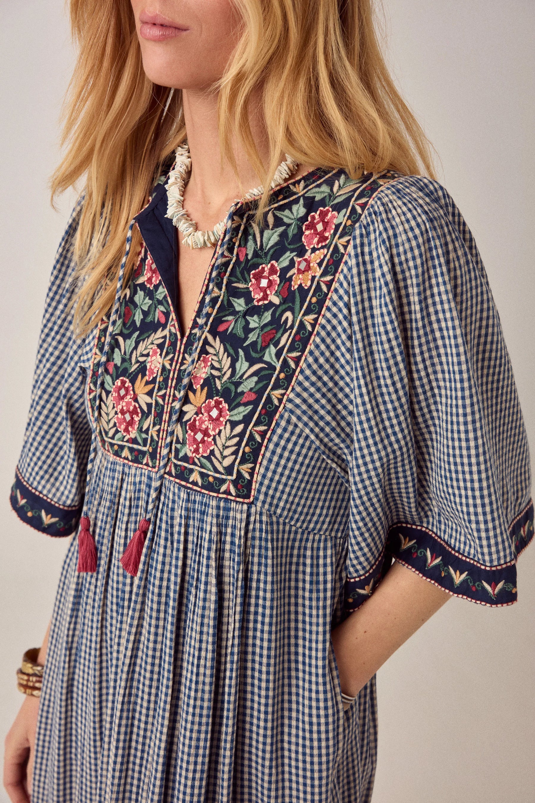 Maison Hotel Augusta Gingham Bloom Dress in Picnic Blue is a midi cotton gingham dress with statement embroidery.