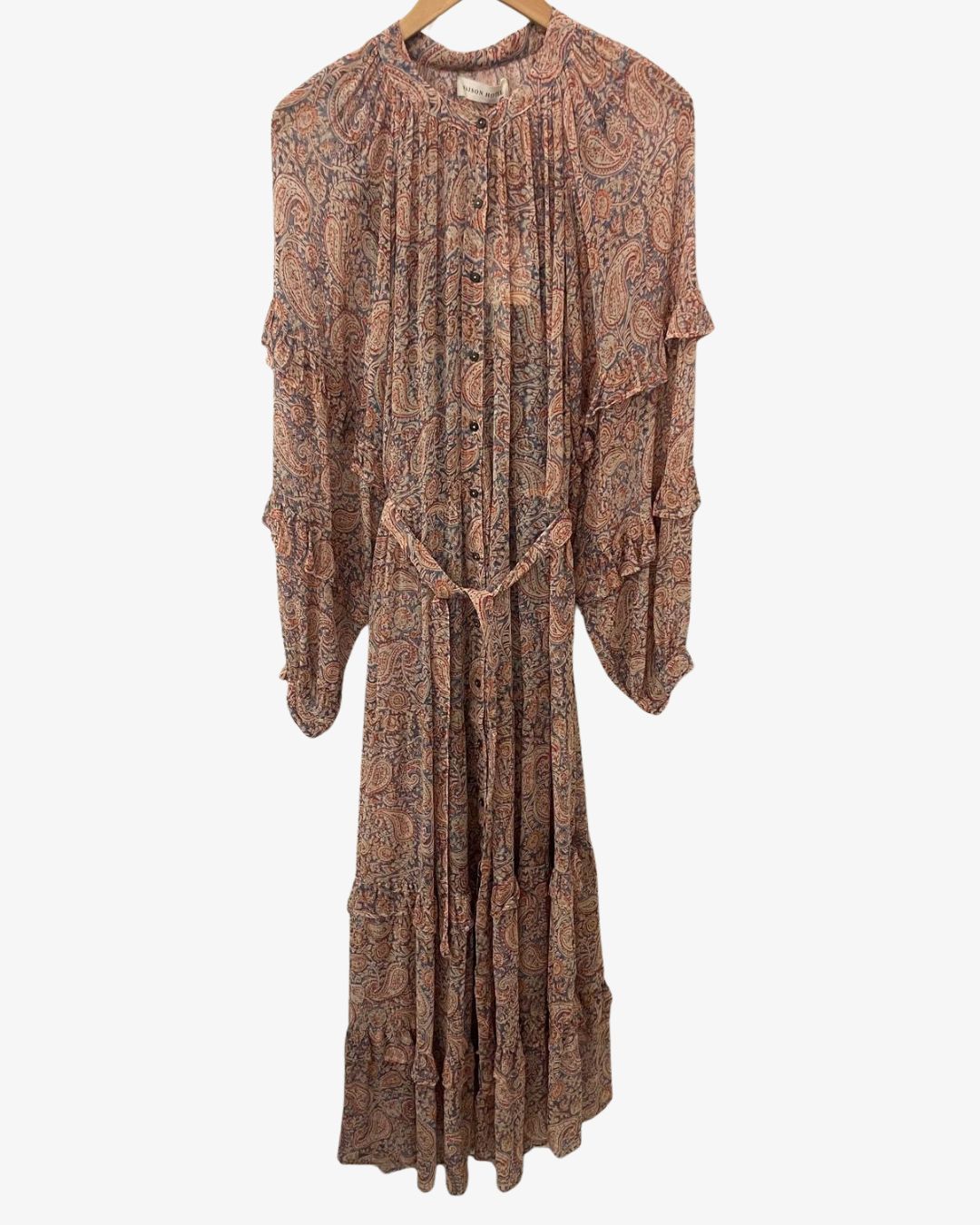  Maison Hotel Paquita Srinagar Dress in Wild Dust is a flowing maxi dress with an all-over paisley print in warm, dusty tones. 
