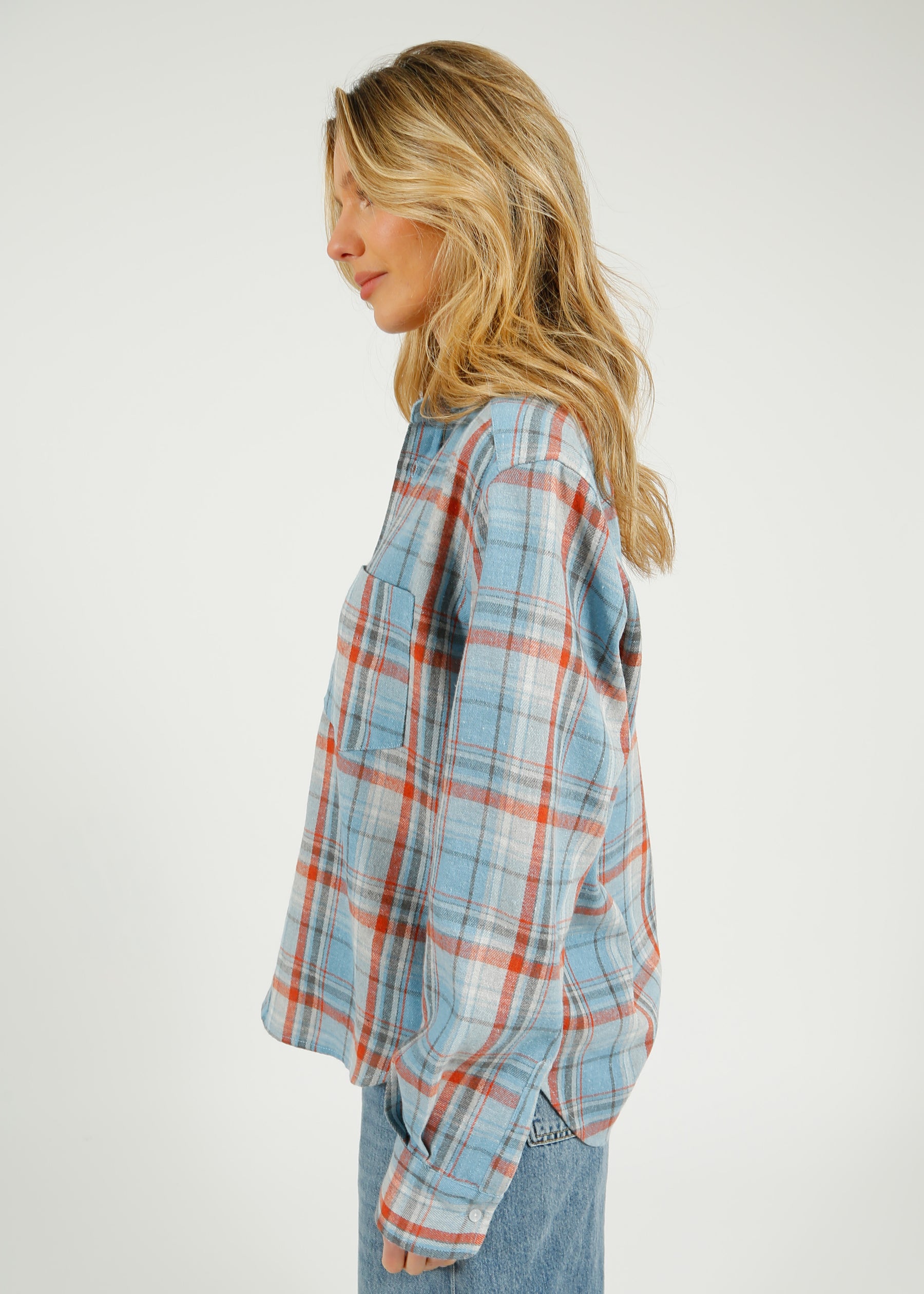 PARK Classic Shirt in Blue Plaid Person wearing a plaid shirt and jeans on a white background