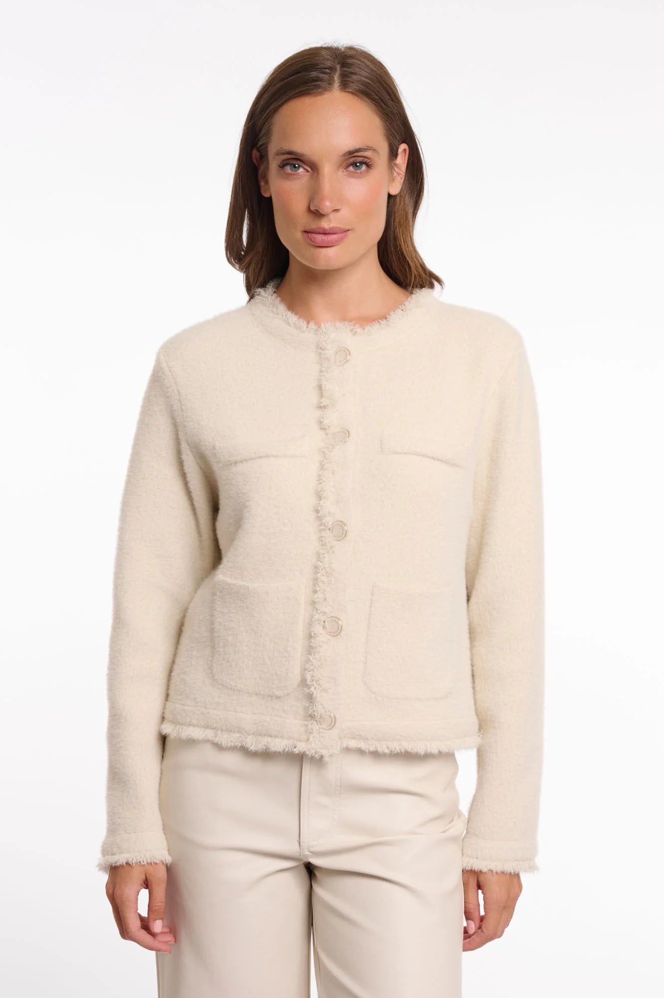 Rino & Pelle Vanna Jacket with Fringe in Birch Woman wearing a cream-colored textured jacket on a white background